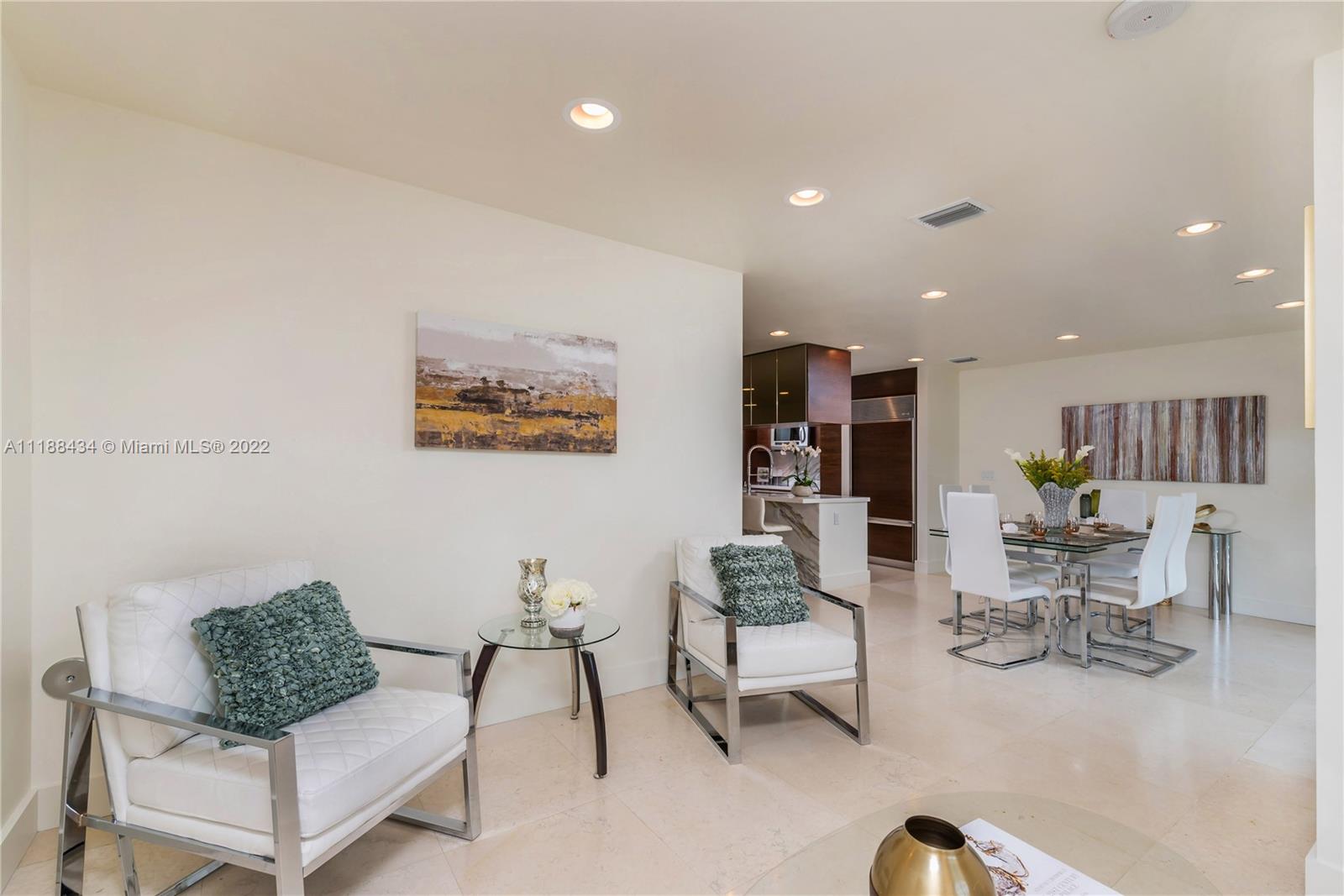 400 Alton Road, Unit TH4A Miami Beach, FL 33139 - Photo 15 of 38 a living room with furniture and white walls