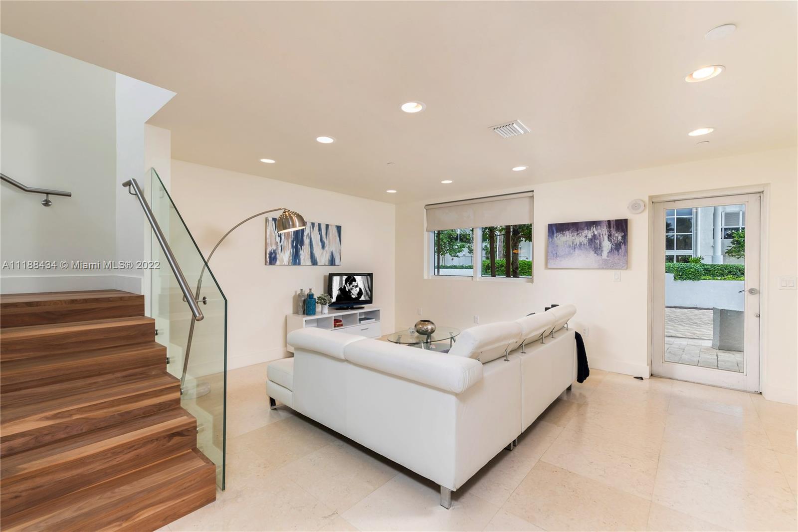 400 Alton Road, Unit TH4A Miami Beach, FL 33139 - Photo 17 of 38 a living room with furniture and a potted plant