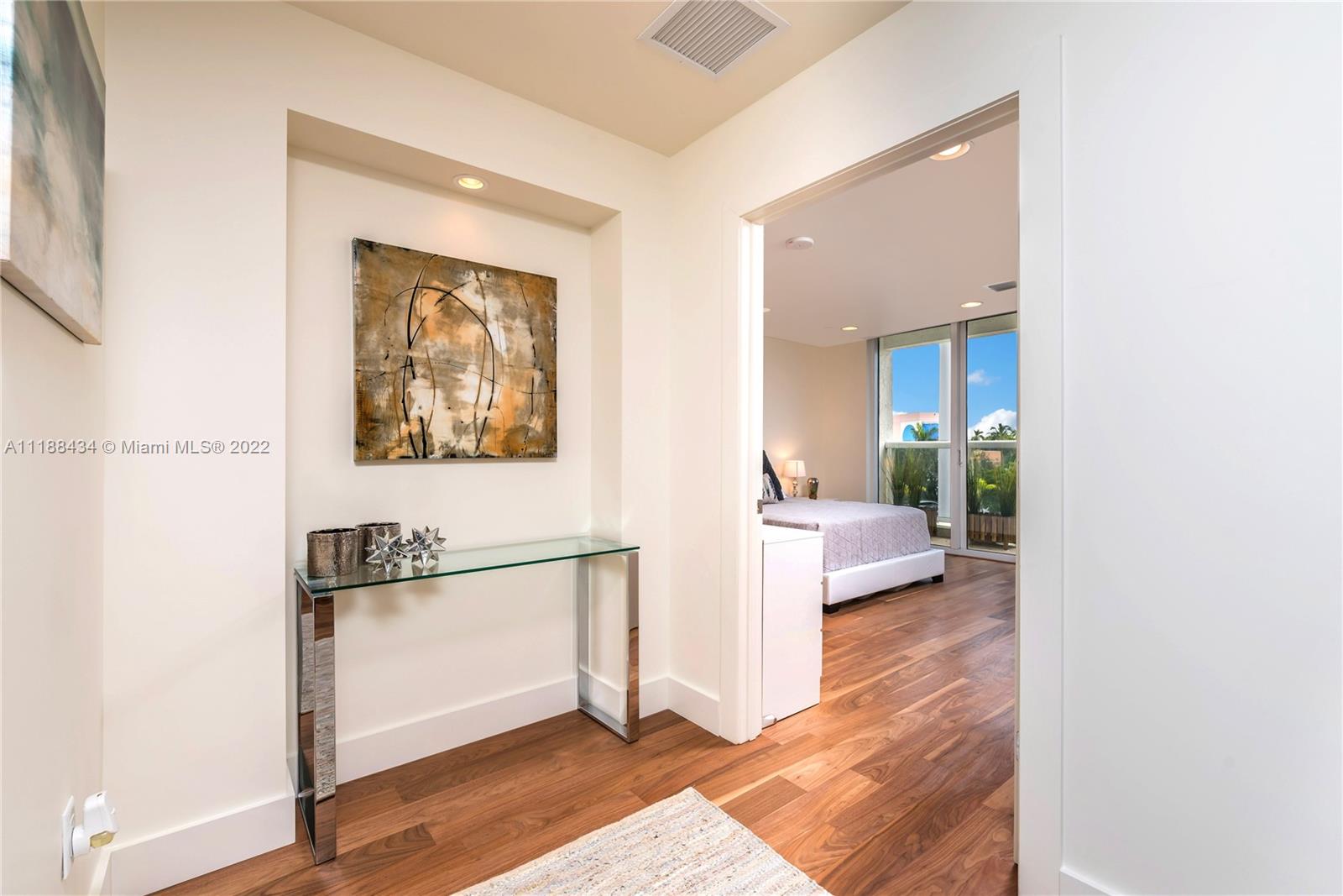 400 Alton Road, Unit TH4A Miami Beach, FL 33139 - Photo 20 of 38 a view of a bedroom from the hallway