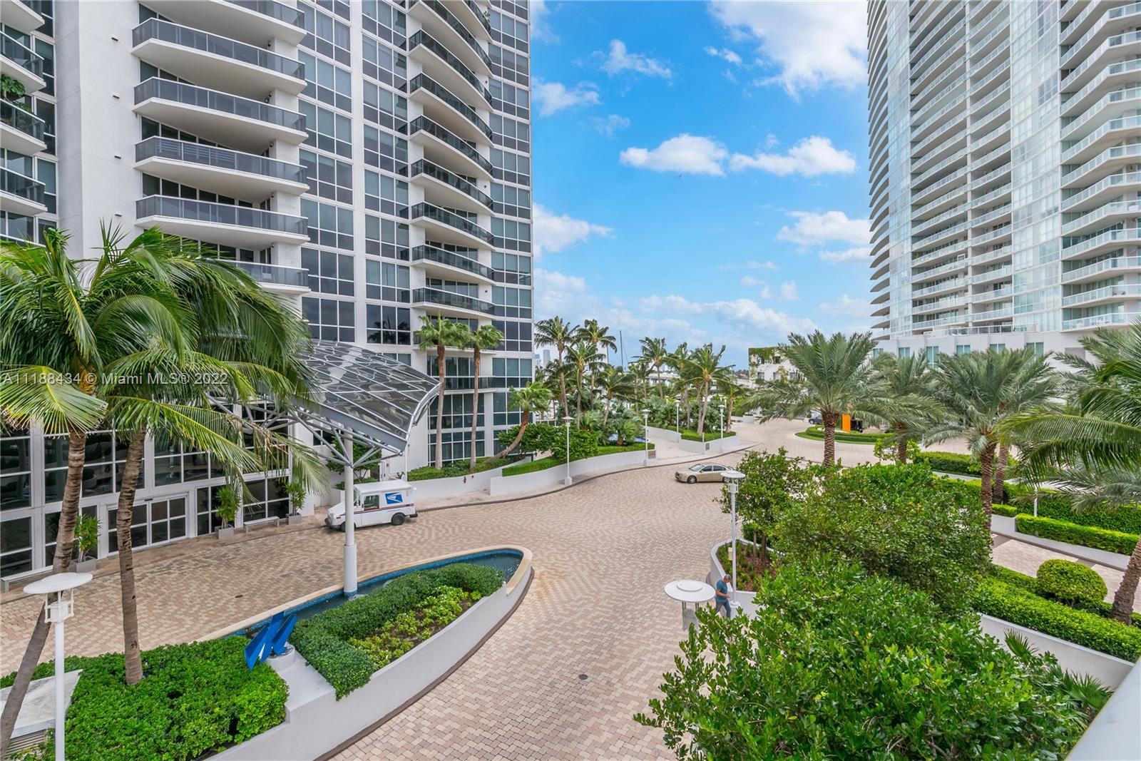 400 Alton Road, Unit TH4A Miami Beach, FL 33139 - Photo 2 of 38 a view of a backyard with plants and palm trees