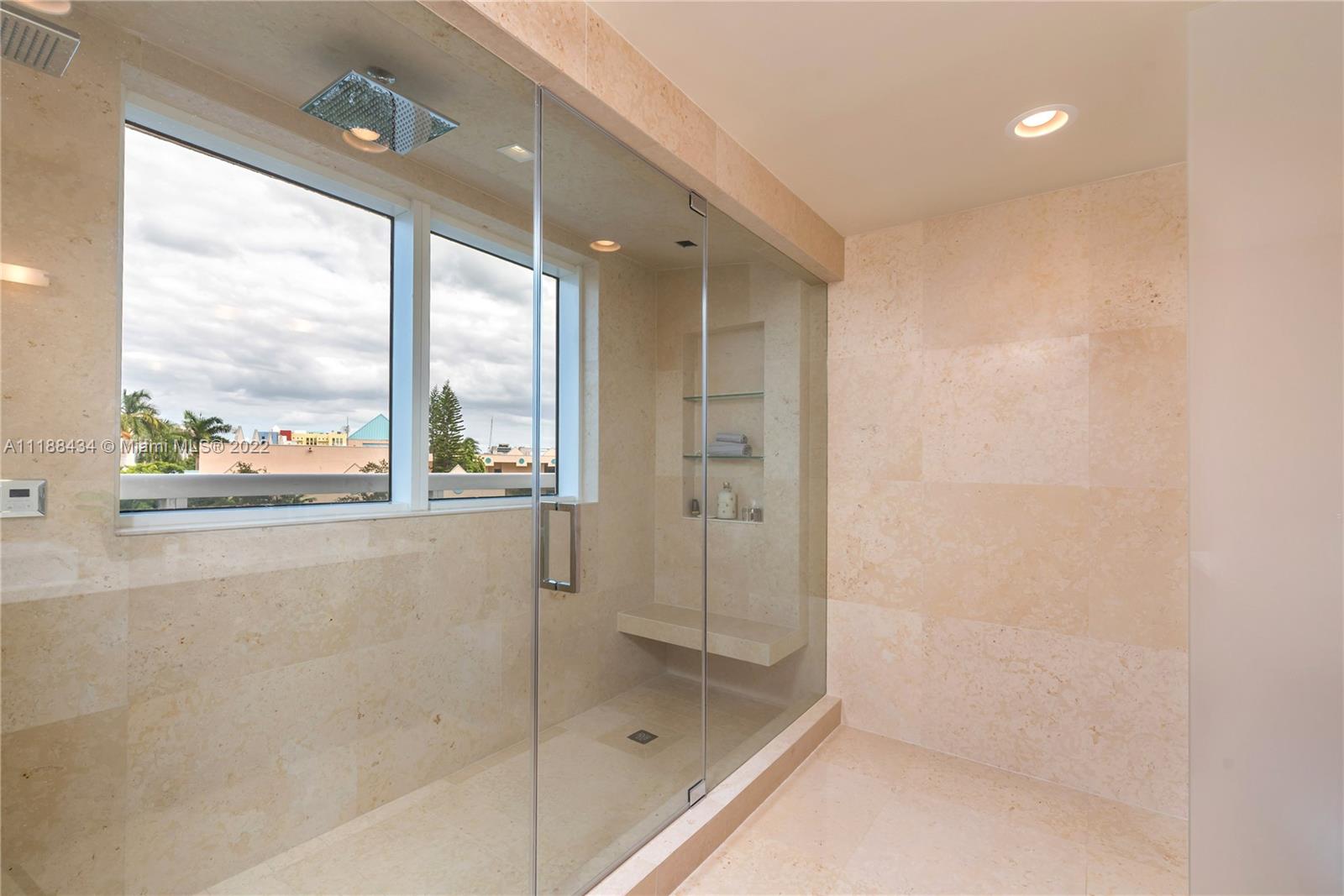 400 Alton Road, Unit TH4A Miami Beach, FL 33139 - Photo 24 of 38 a bathroom with a bathtub and a shower
