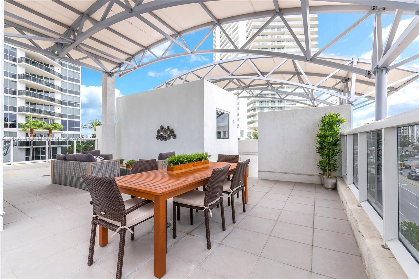 400 Alton Road, Unit TH4A Miami Beach, FL 33139 - Photo 29 of 38 a view of a dining room with furniture window and outside view