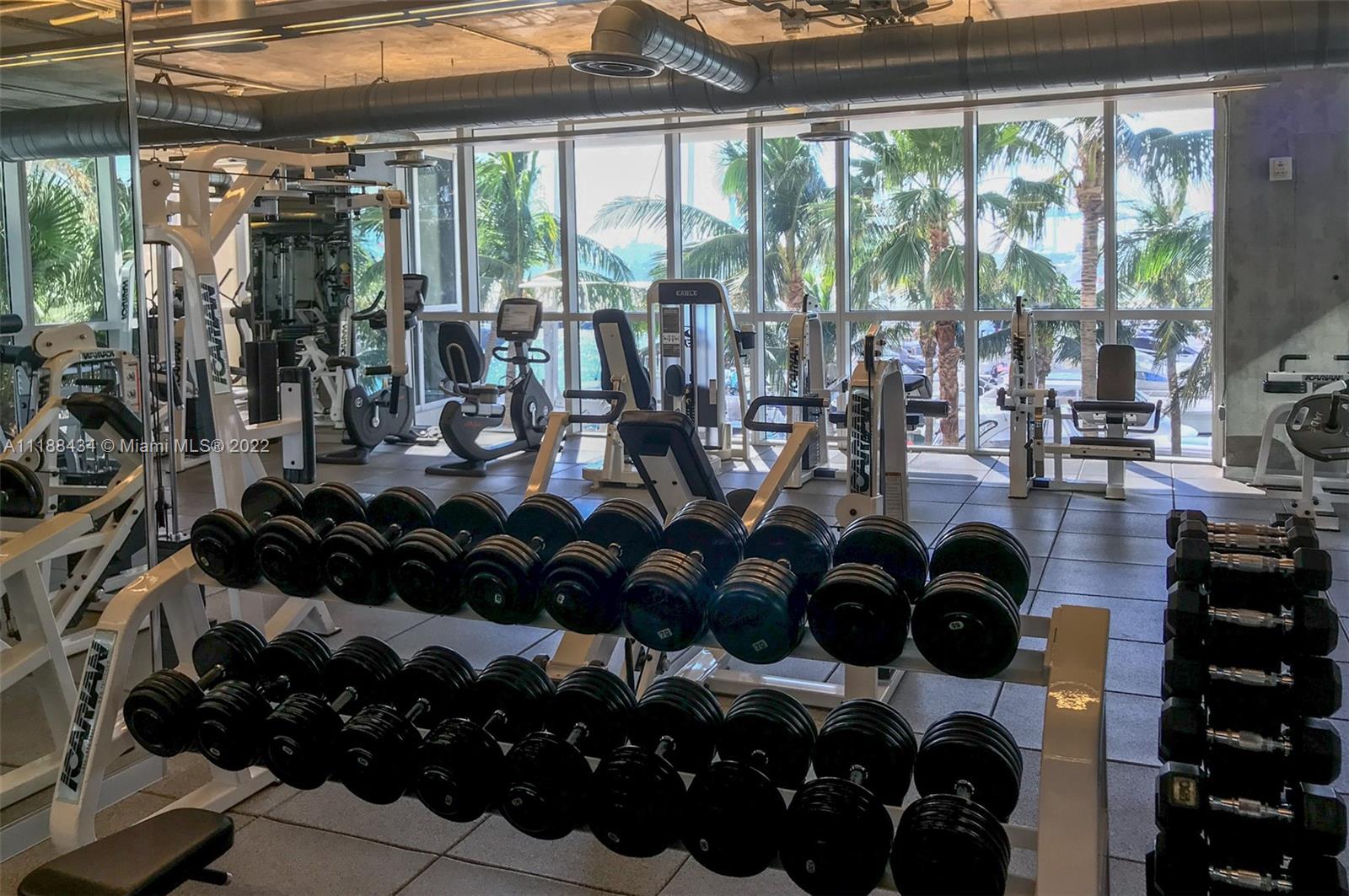 400 Alton Road, Unit TH4A Miami Beach, FL 33139 - Photo 34 of 38 a room with lots of windows and flowers