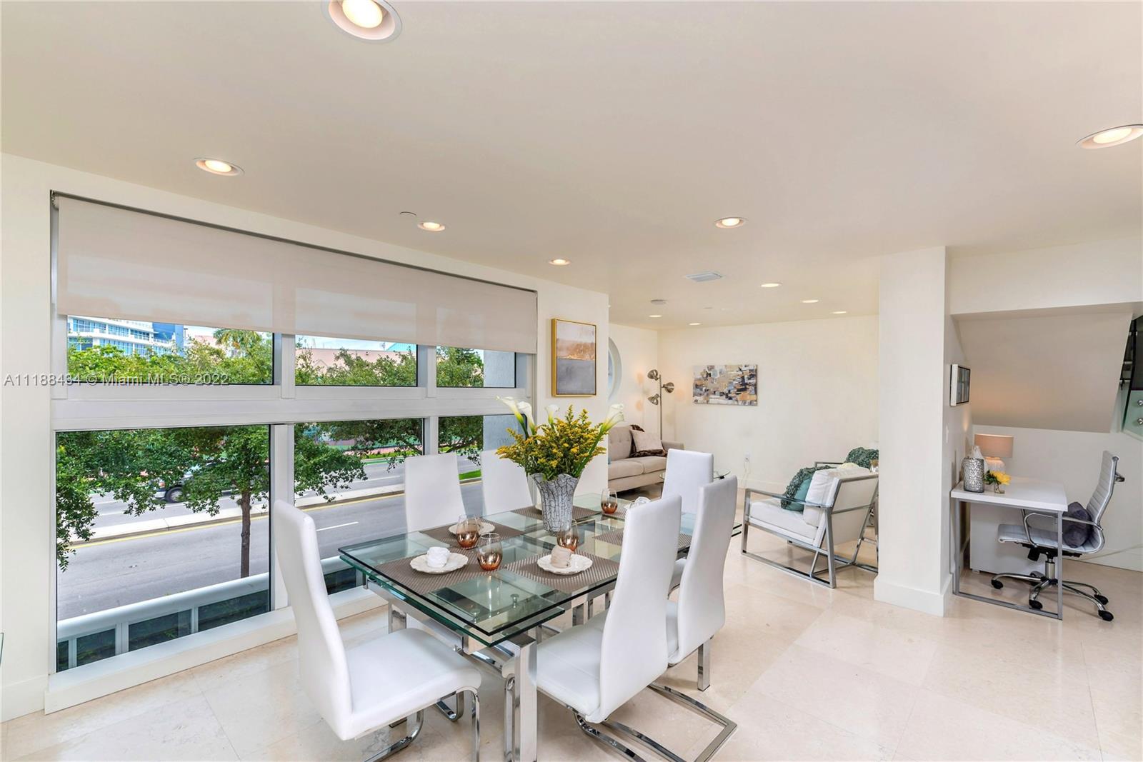 400 Alton Road, Unit TH4A Miami Beach, FL 33139 - Photo 6 of 38 a living room with furniture and a large window