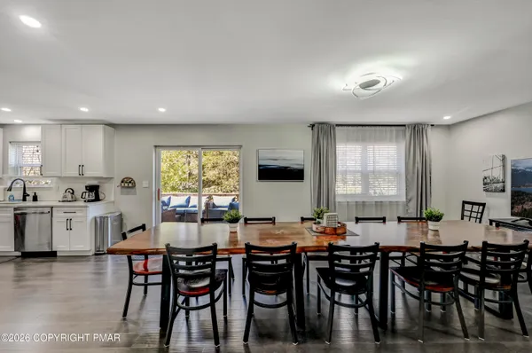 a view of a dining room with furniture and window