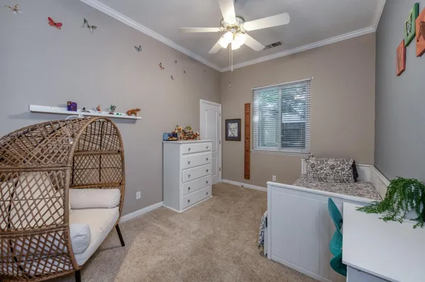 a bedroom with a large bed and a flat screen tv