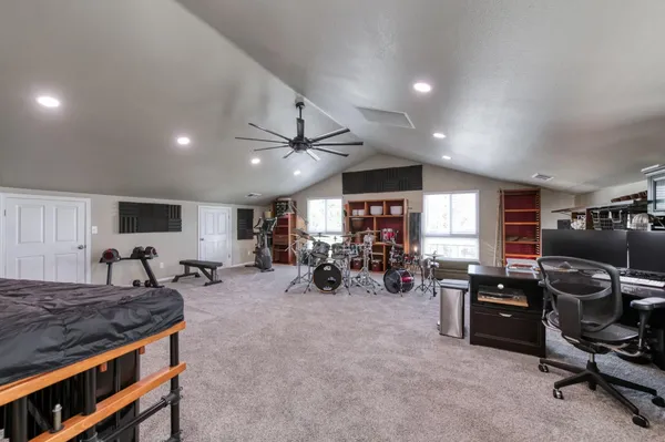 a living room with furniture kitchen area and a couch
