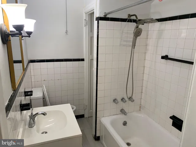a bathroom with a bathtub and shower