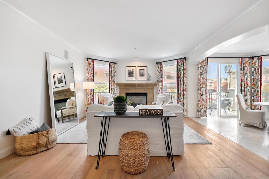 848 Prospect Street, Unit E La Jolla, CA 92037 - Photo 1 of 16 a living room with furniture and a fireplace