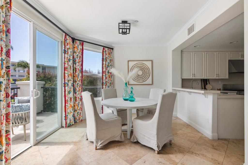 848 Prospect Street, Unit E La Jolla, CA 92037 - Photo 14 of 16 a view of a dining room with furniture window and outside view