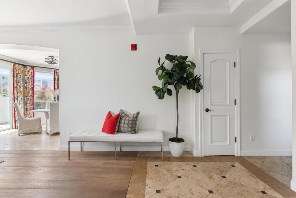848 Prospect Street, Unit E La Jolla, CA 92037 - Photo 15 of 16 a living room with furniture and a potted plant