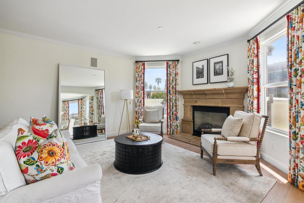 848 Prospect Street, Unit E La Jolla, CA 92037 - Photo 7 of 16 a living room with furniture and a fireplace