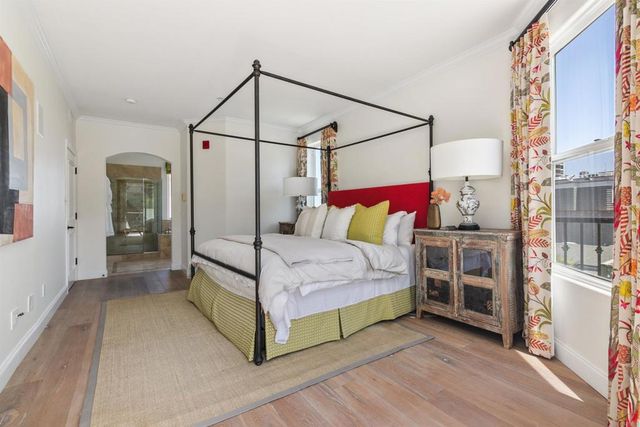 a bedroom with a bed and a walk in closet