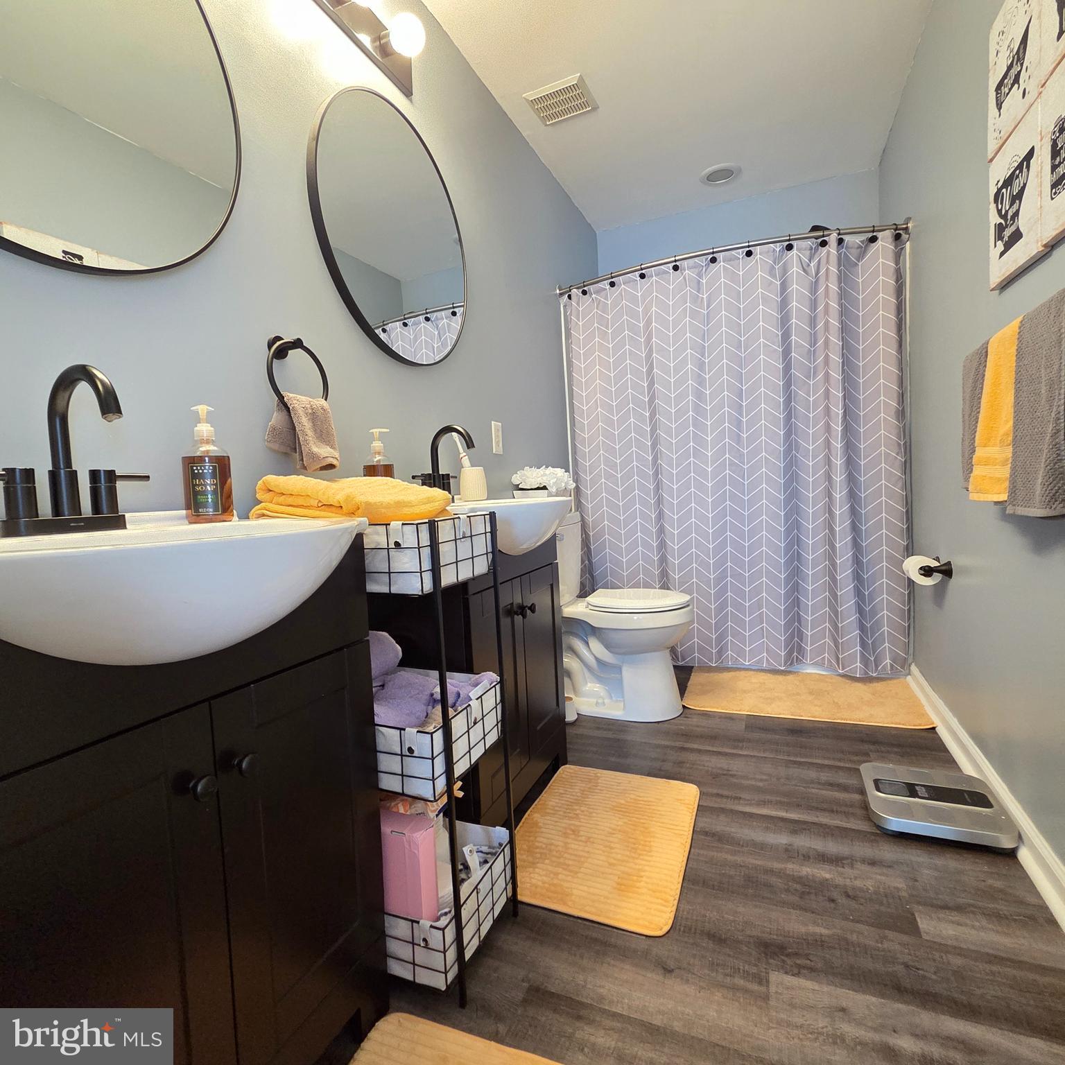 34 Springfield Circle Middletown, DE 19709 - Photo 16 of 34 a bathroom with a sink a toilet and a mirror