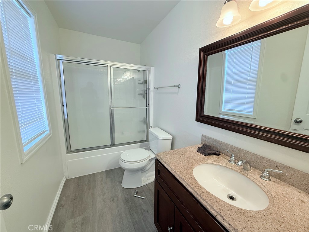 9287 Sierra Vista Circle Pico Rivera, CA 90660 - Photo 12 of 16 a bathroom with a granite countertop sink toilet and shower