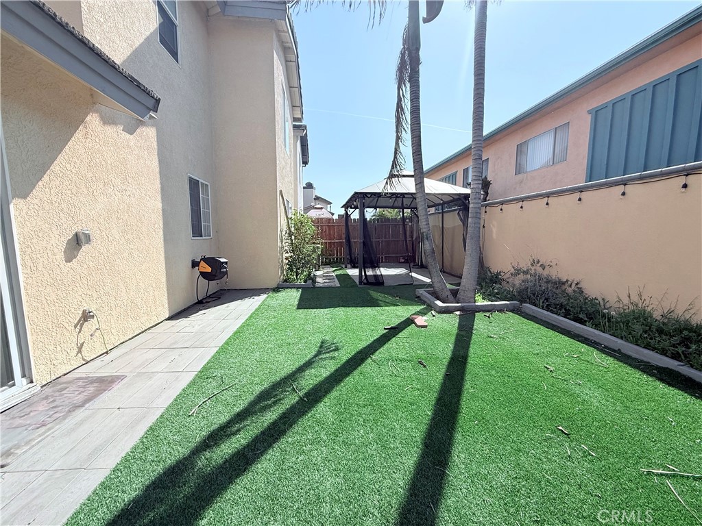 9287 Sierra Vista Circle Pico Rivera, CA 90660 - Photo 5 of 16 a view of a backyard with potted plants