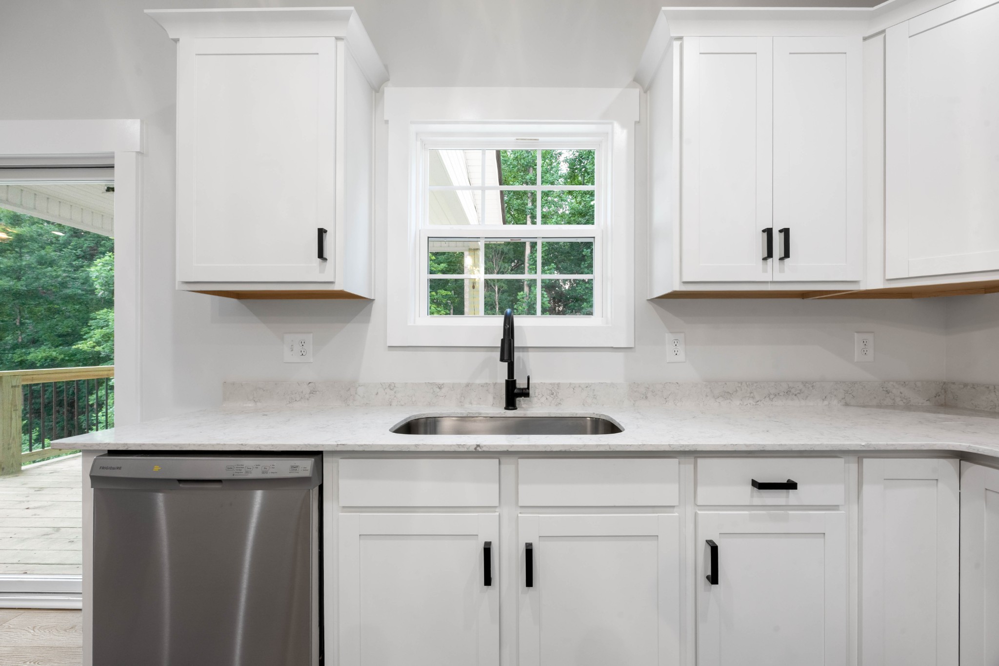 1146 Black Rock Road Clarksville, TN 37040 - Photo 15 of 36 a kitchen with stainless steel appliances white cabinets and a window