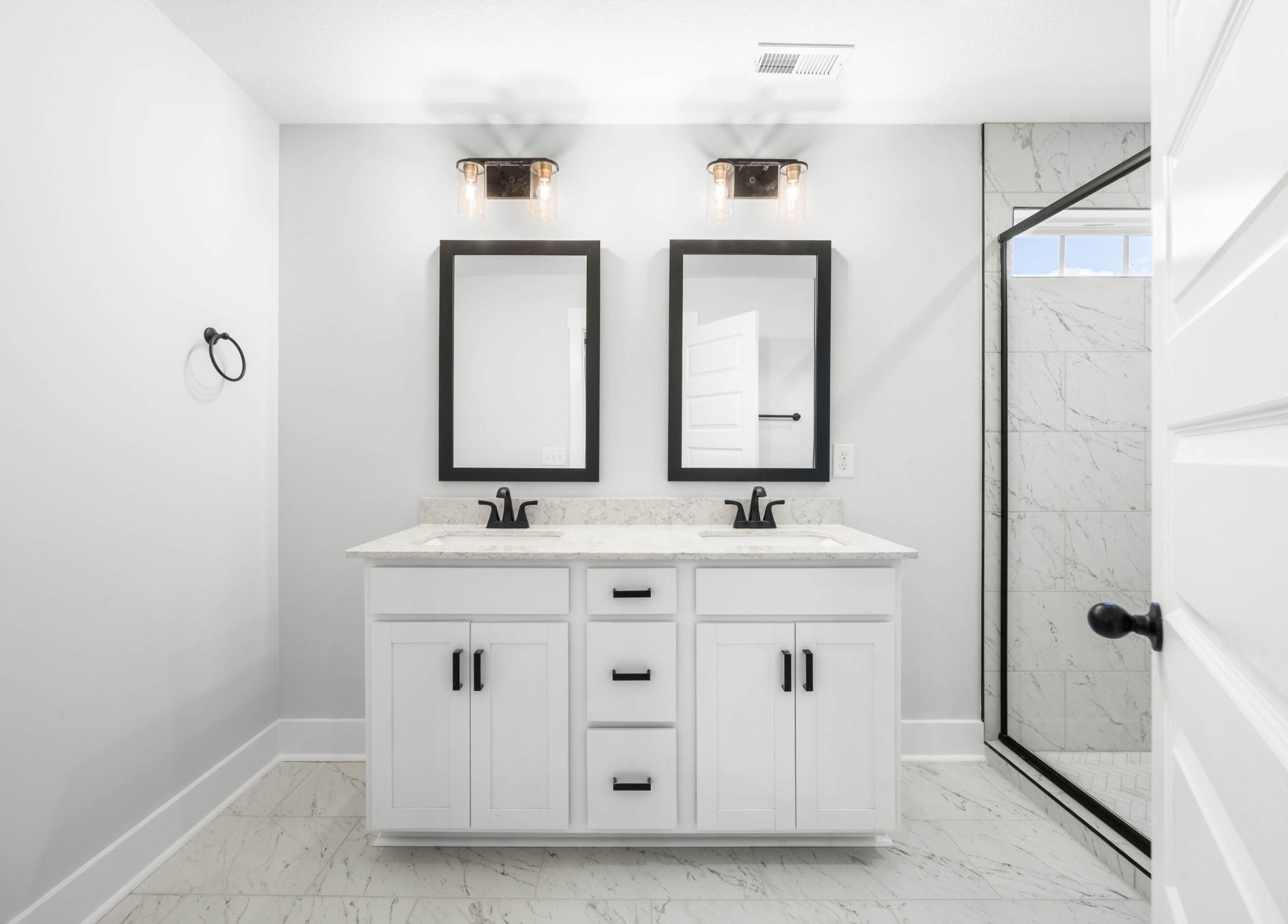 1146 Black Rock Road Clarksville, TN 37040 - Photo 22 of 36 a bathroom with double vanity sink two mirror and a