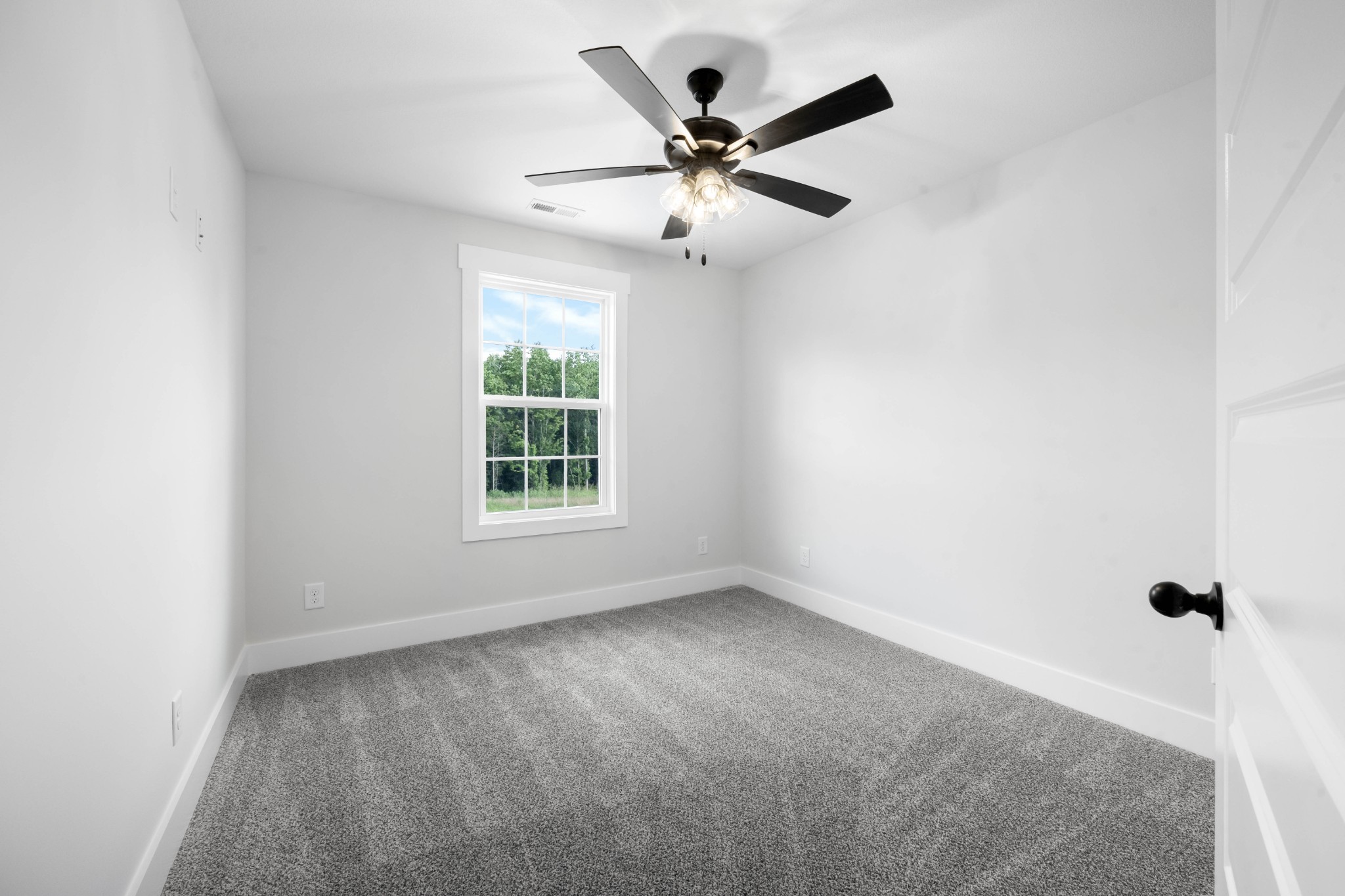 1146 Black Rock Road Clarksville, TN 37040 - Photo 28 of 36 an empty room with a window and a fan