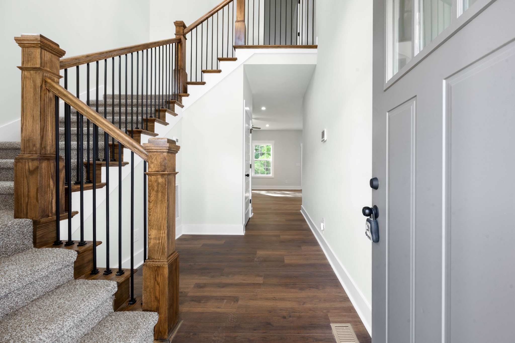 1146 Black Rock Road Clarksville, TN 37040 - Photo 7 of 36 a view of staircase with lots of frames on wall and a window