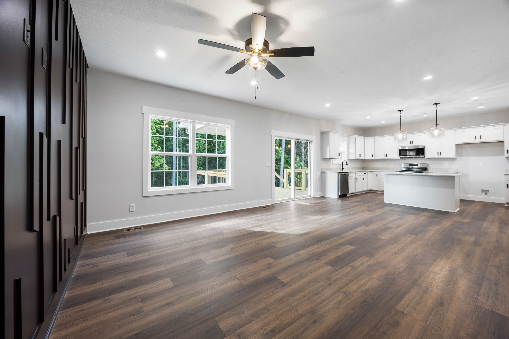 1146 Black Rock Road Clarksville, TN 37040 - Photo 9 of 36 a view of an empty room with a window and wooden floor