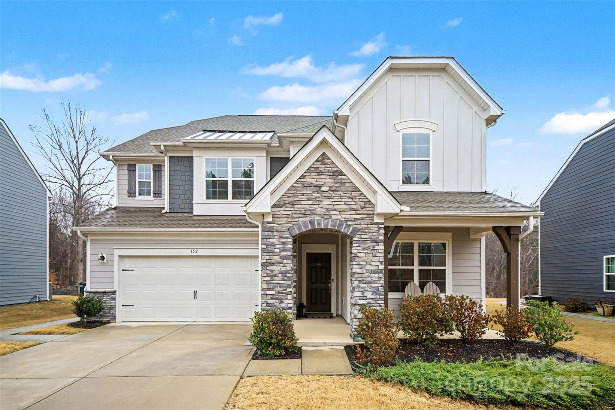 a front view of a house with garden