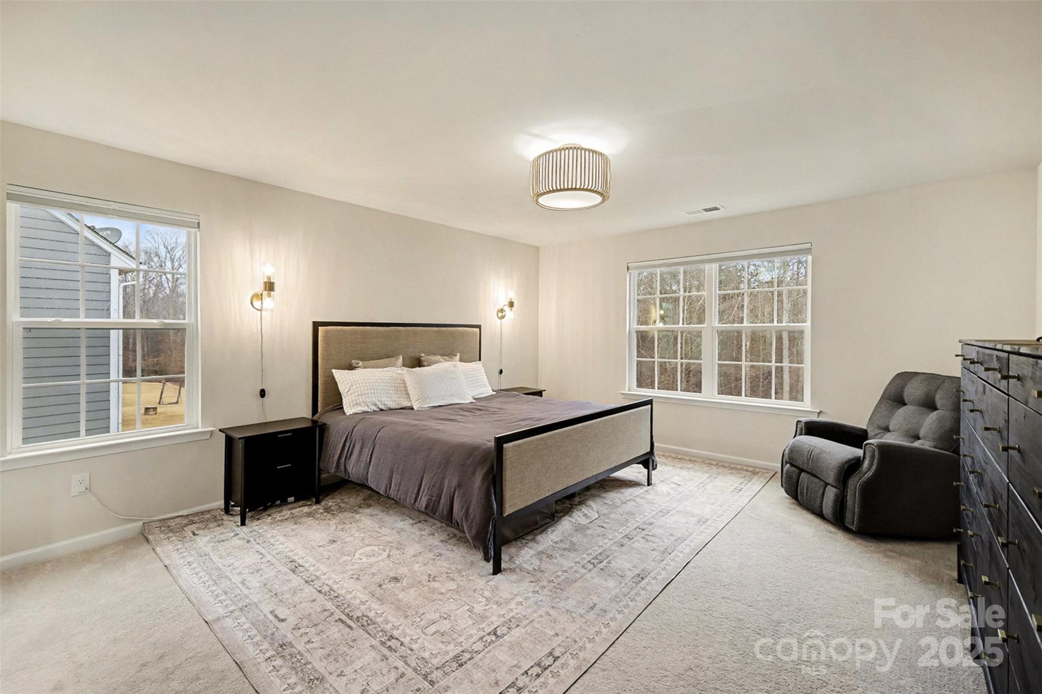 152 Tackle Troutman, NC 28166 - Photo 11 of 31 a spacious bedroom with a bed and glass window