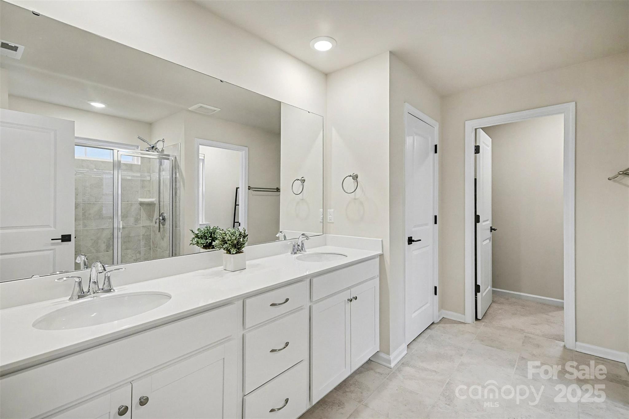 152 Tackle Troutman, NC 28166 - Photo 12 of 31 a spacious bathroom with a double vanity sink mirror and double