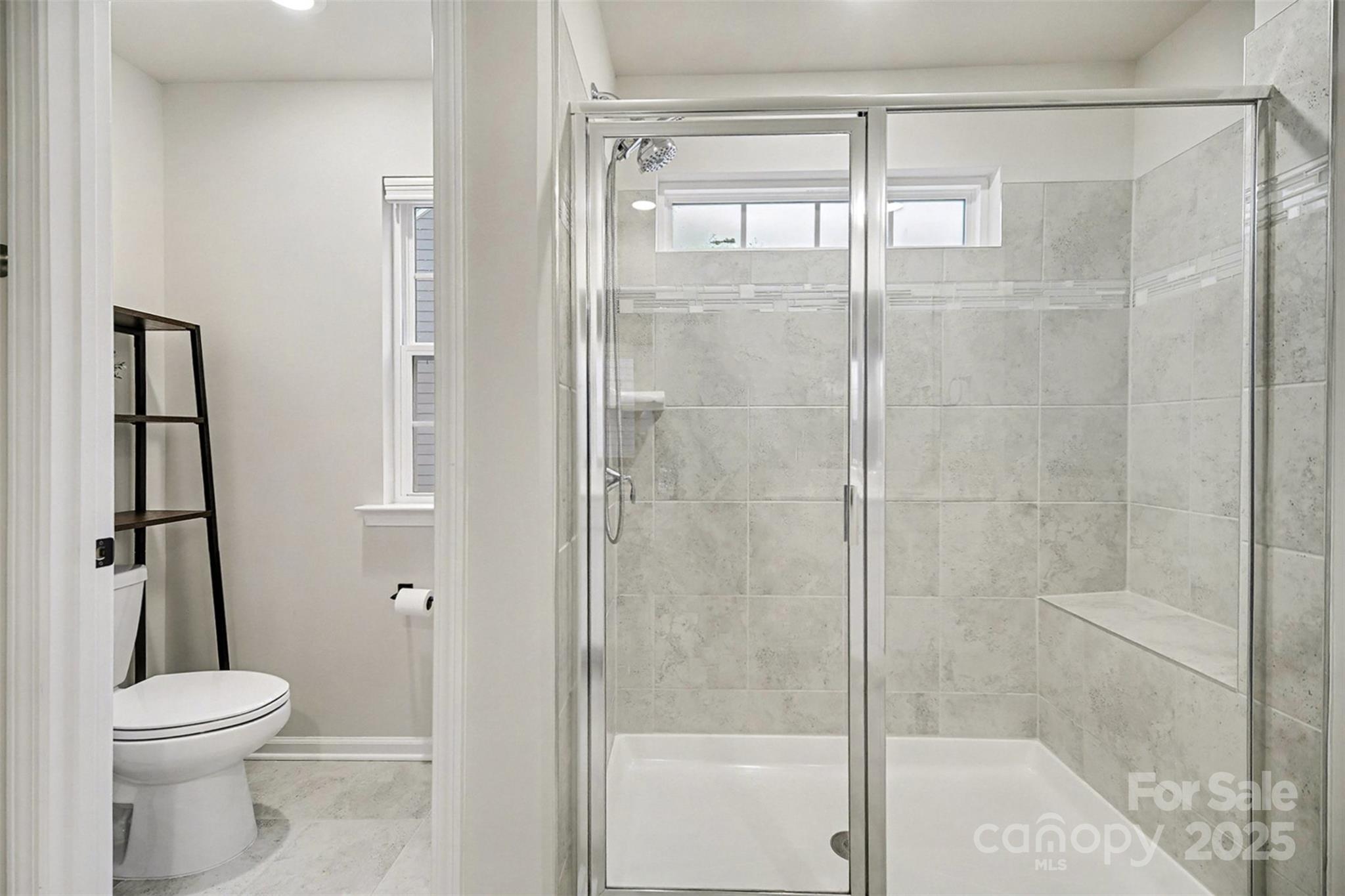 152 Tackle Troutman, NC 28166 - Photo 13 of 31 a bathroom with a shower and a toilet