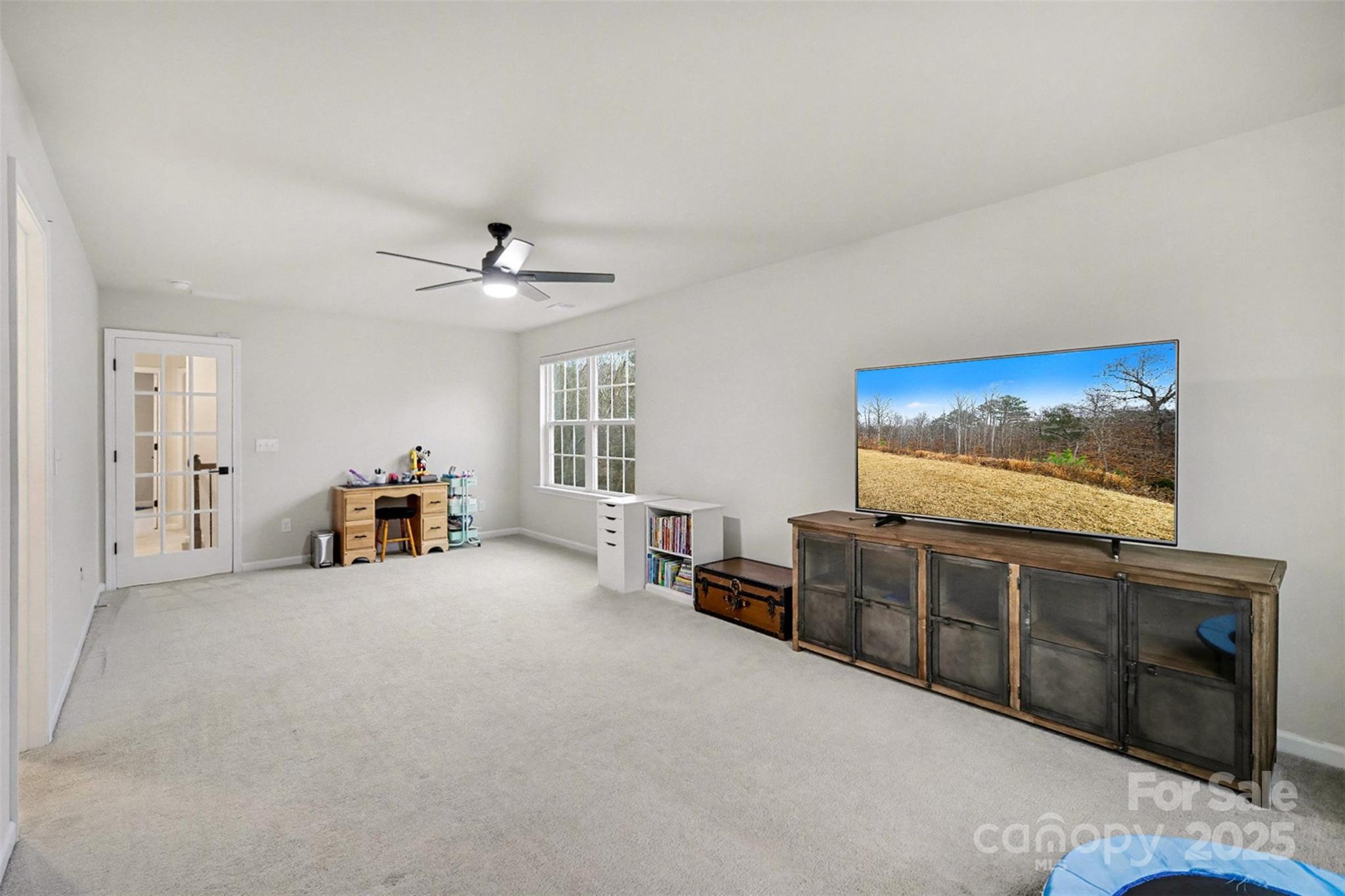 152 Tackle Troutman, NC 28166 - Photo 15 of 31 a living room with furniture and a flat screen tv