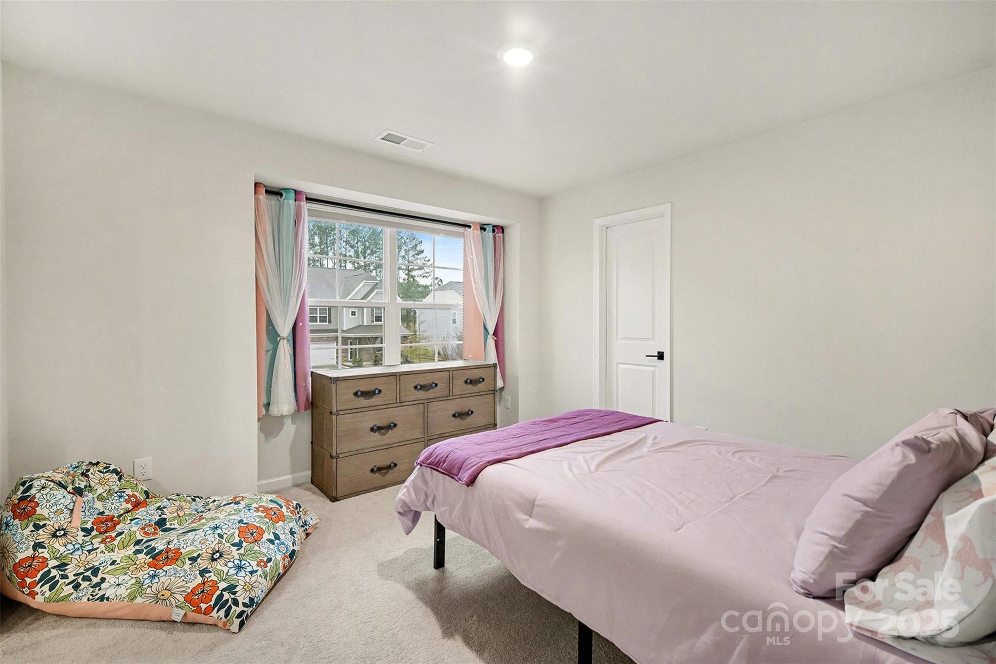 152 Tackle Troutman, NC 28166 - Photo 17 of 31 a bedroom with a bed and a window