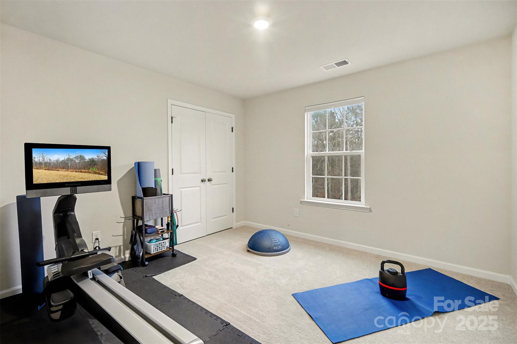 152 Tackle Troutman, NC 28166 - Photo 20 of 31 a bedroom with furniture and a window