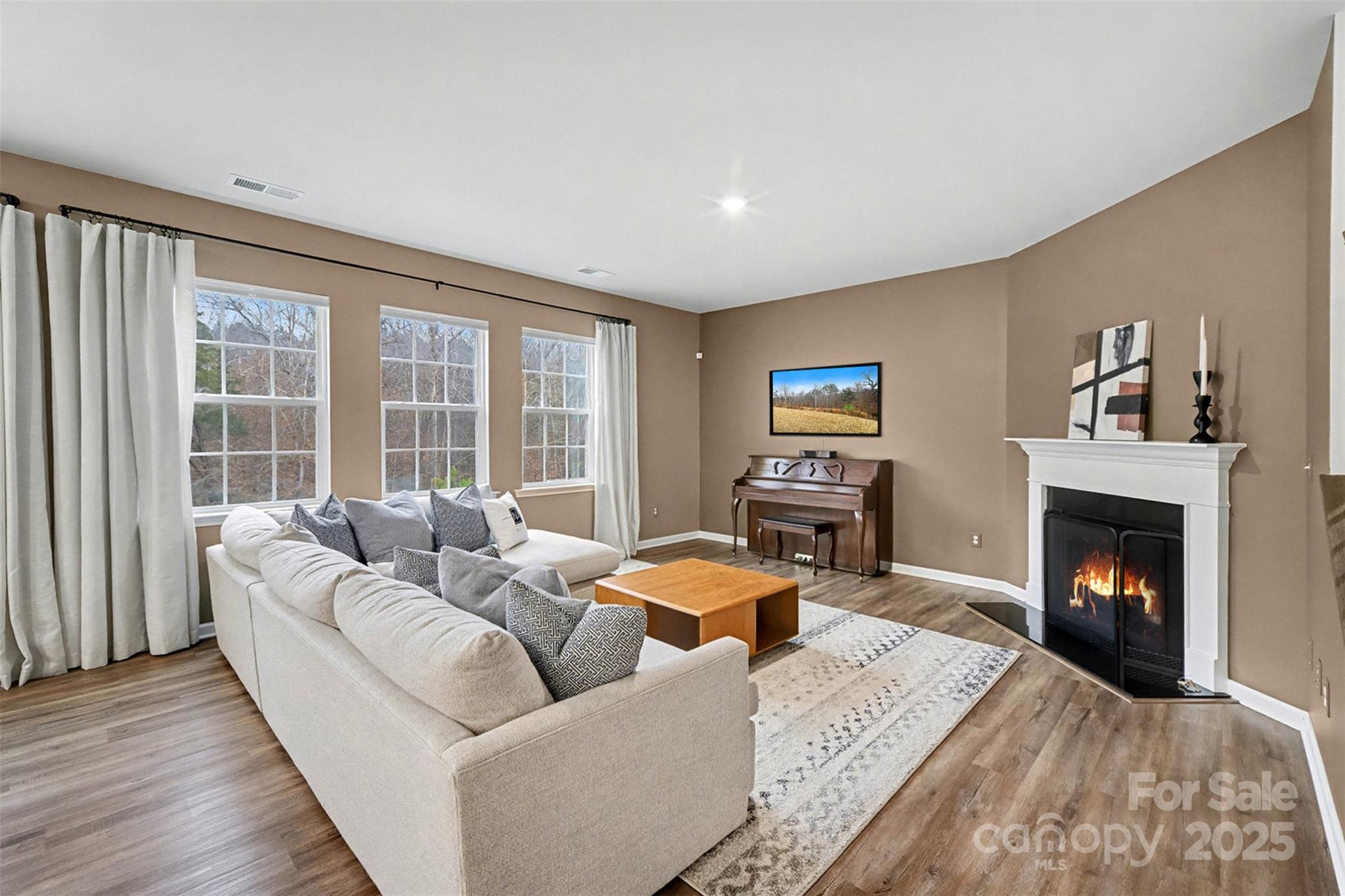 152 Tackle Troutman, NC 28166 - Photo 6 of 31 a living room with furniture and a fireplace