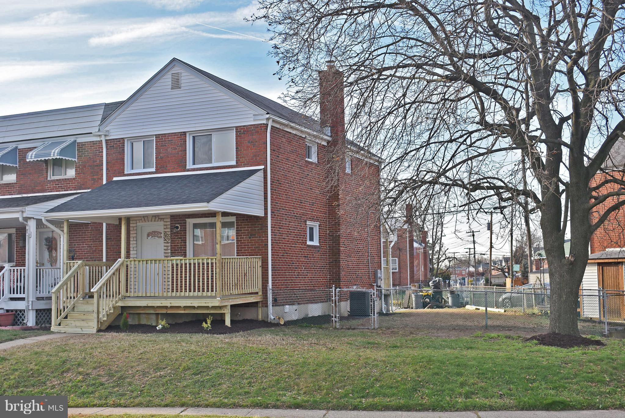 7809 Harold Road Baltimore, MD 21222 - Photo 2 of 36 front view of house with a yard