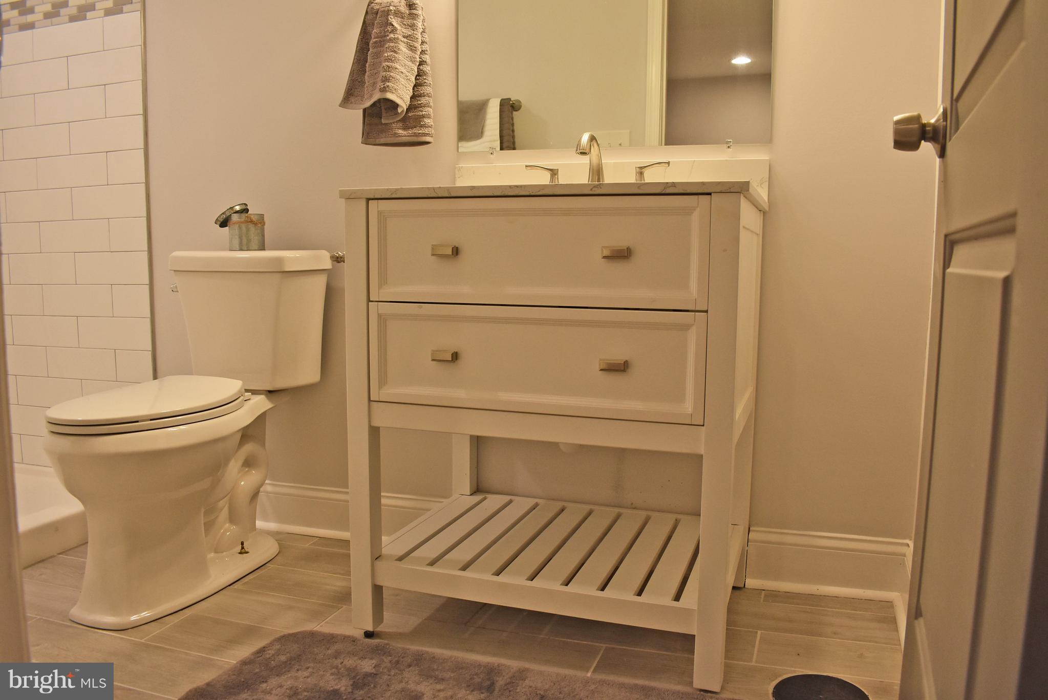 7809 Harold Road Baltimore, MD 21222 - Photo 21 of 36 a bathroom with a sink and a toilet