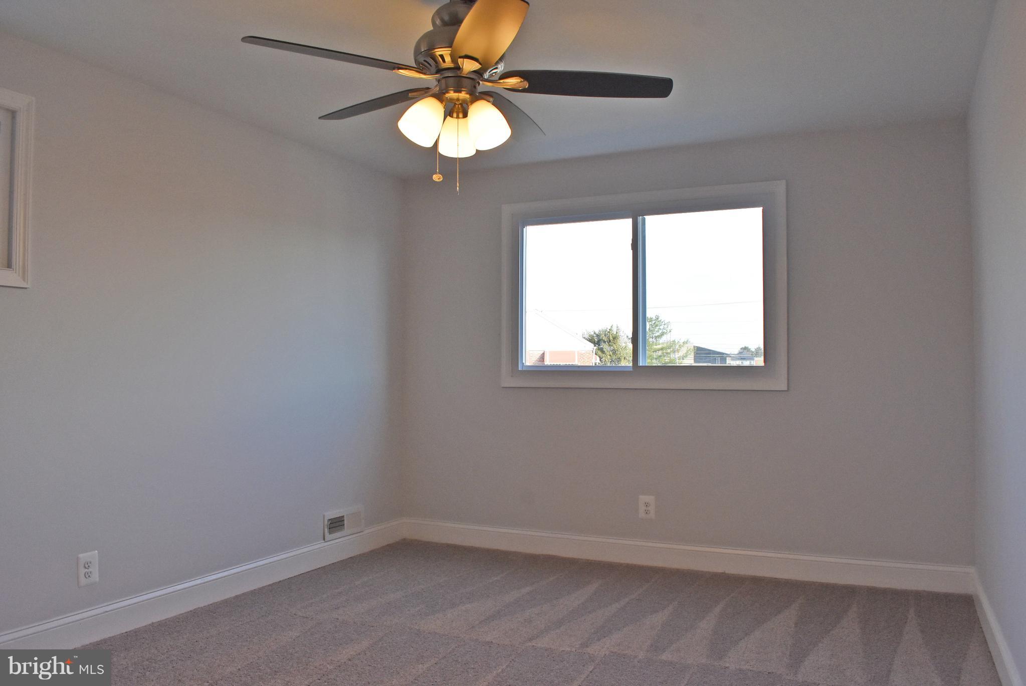 7809 Harold Road Baltimore, MD 21222 - Photo 22 of 36 an empty room with a window