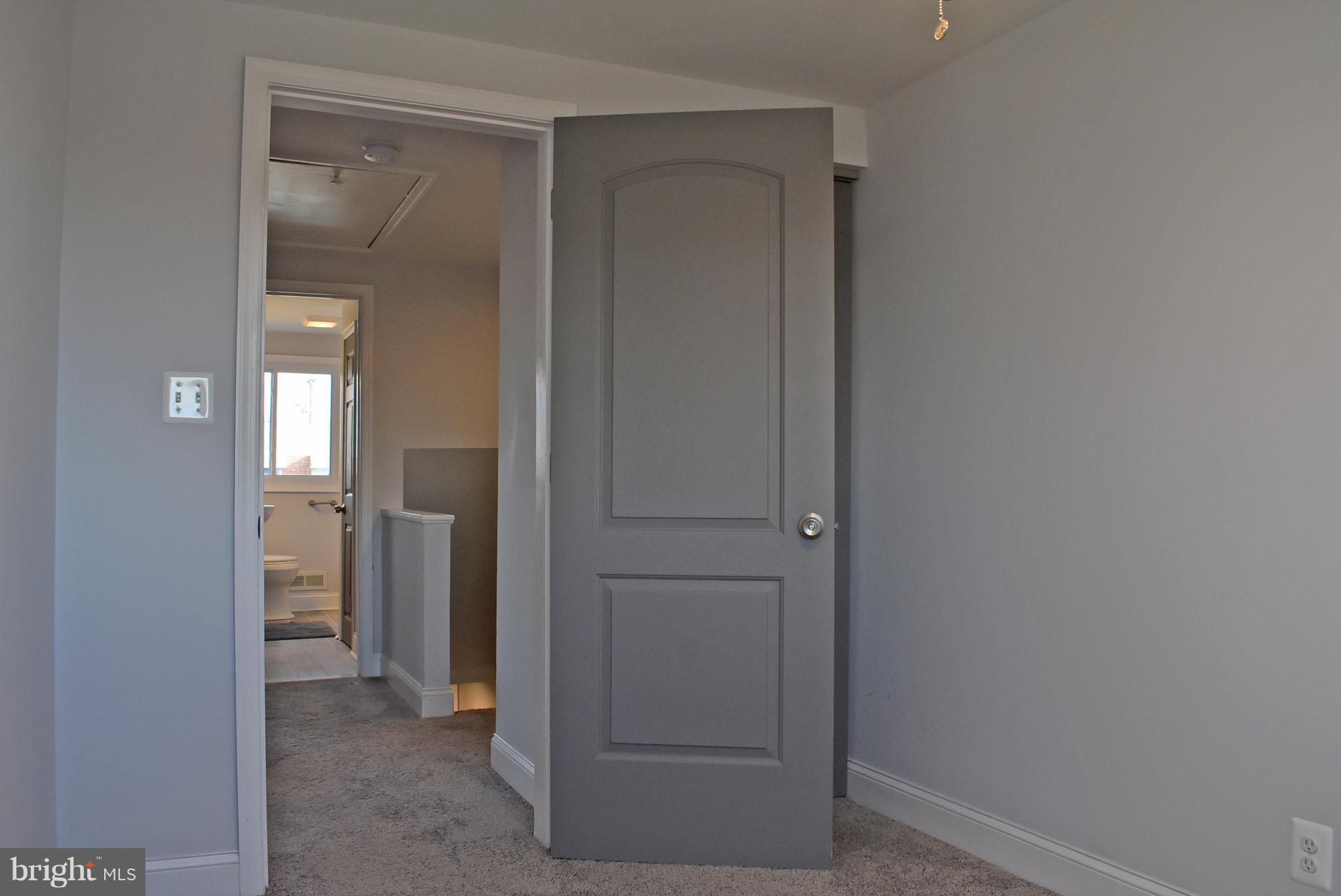 7809 Harold Road Baltimore, MD 21222 - Photo 27 of 36 a view of a bathroom from a hallway to other door