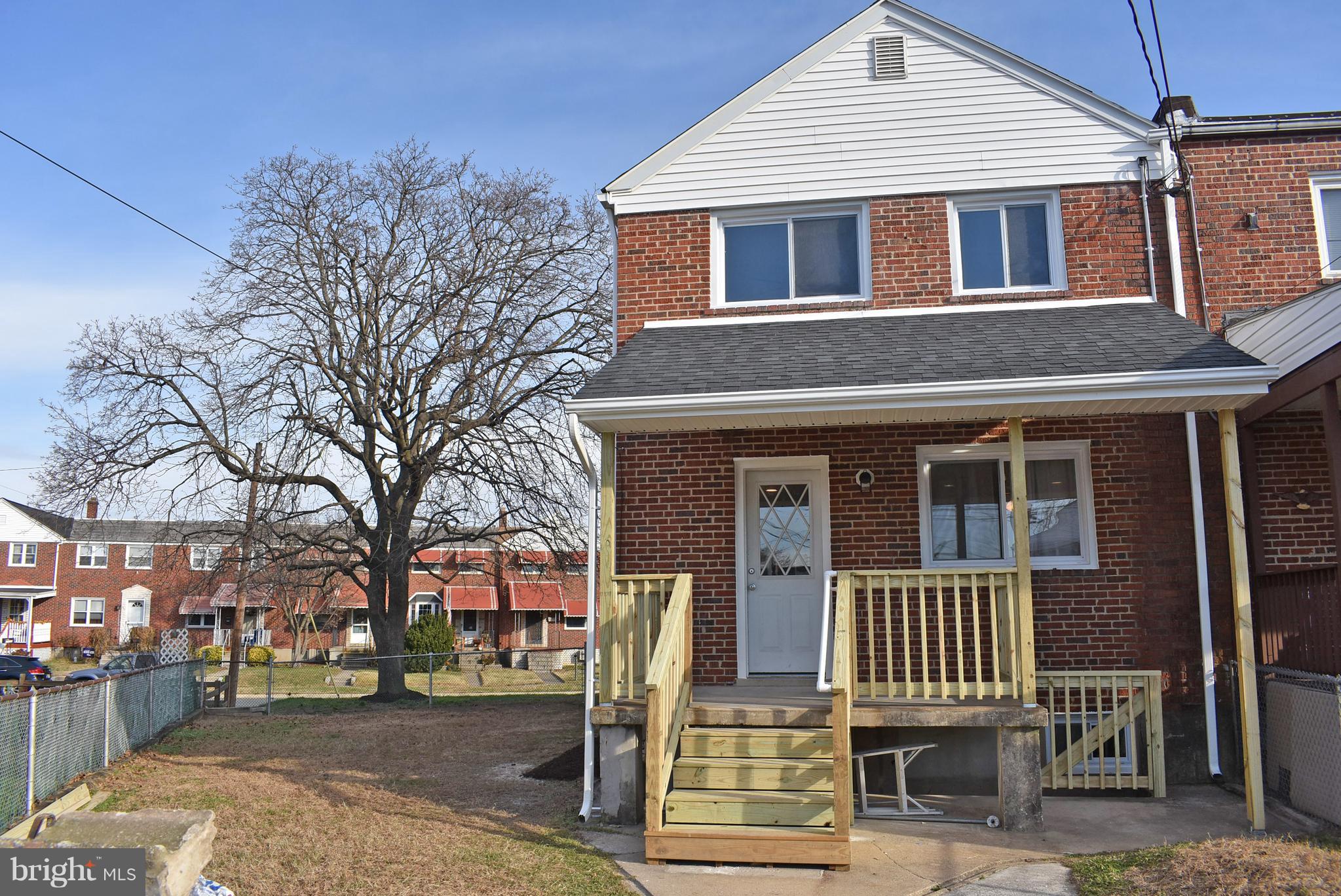 7809 Harold Road Baltimore, MD 21222 - Photo 34 of 36 a front view of a house with a tree