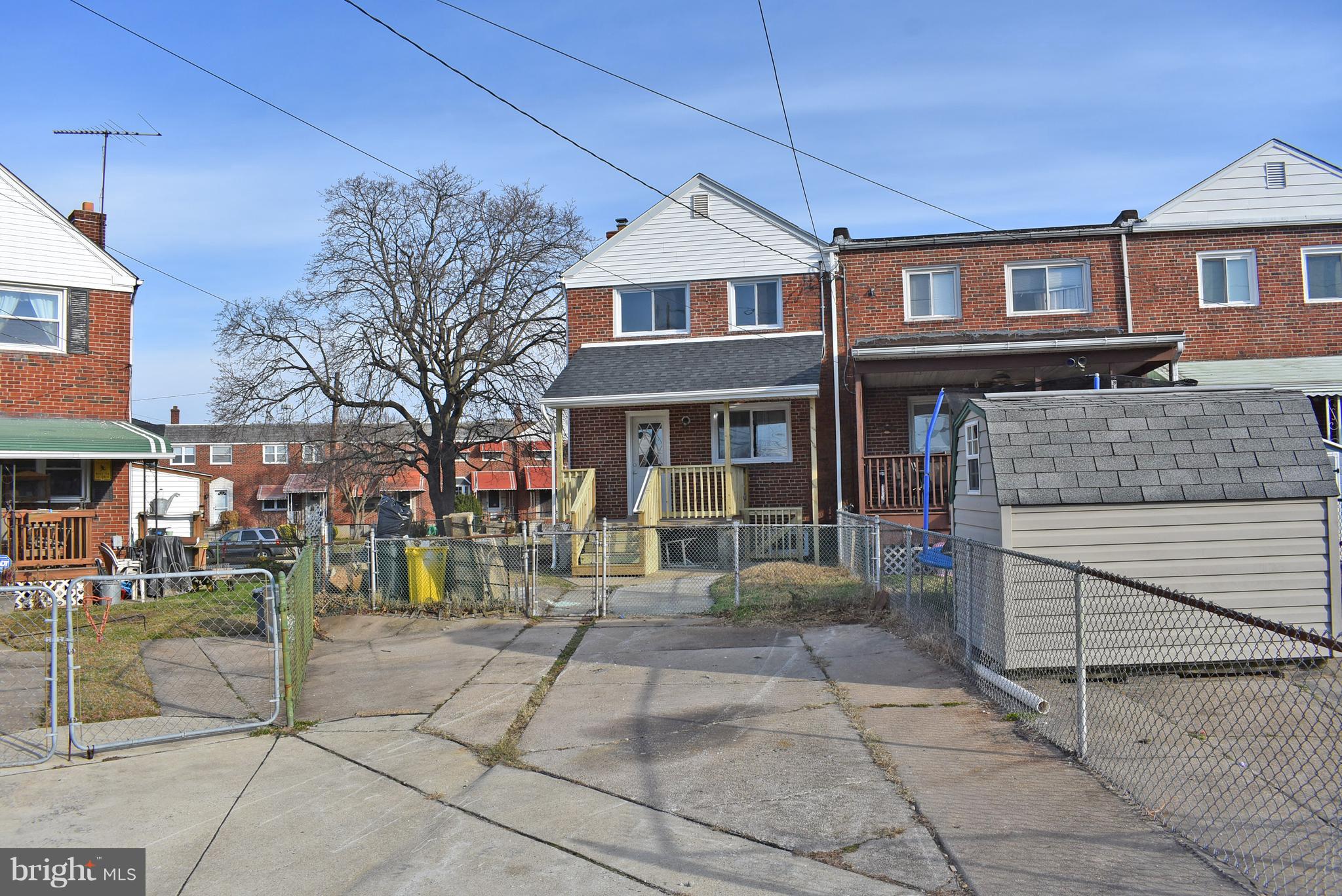 7809 Harold Road Baltimore, MD 21222 - Photo 35 of 36 a front view of a house with a garden