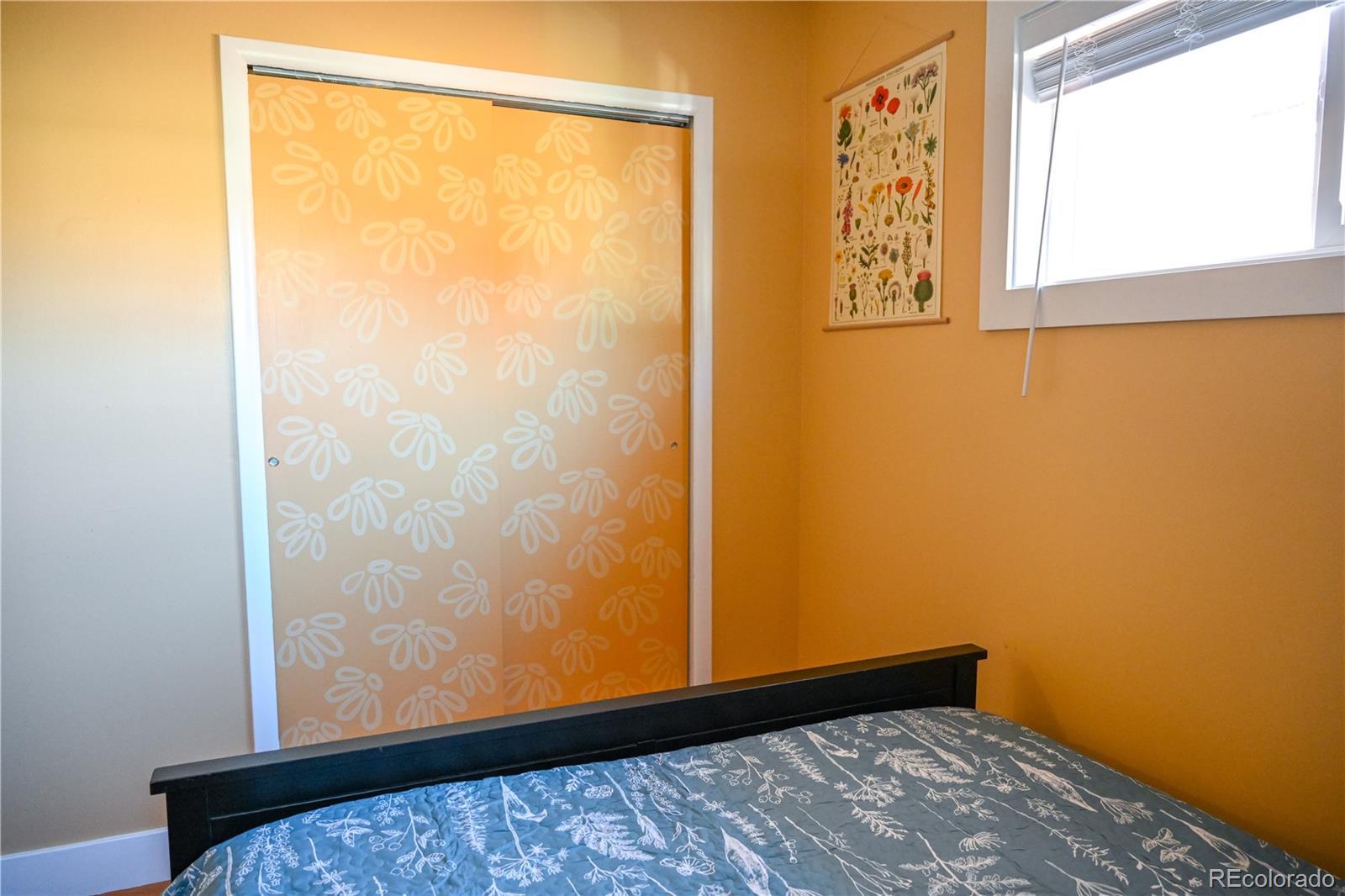 7051 Ruth Way Denver, CO 80221 - Photo 17 of 36 a view of a small room with wooden floor and a window