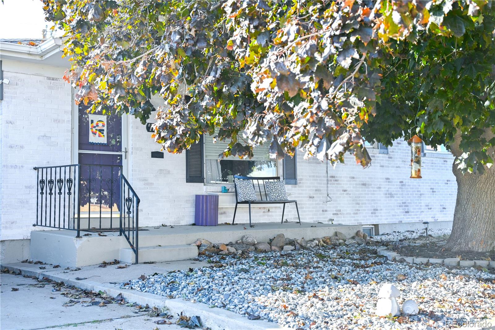 7051 Ruth Way Denver, CO 80221 - Photo 2 of 36 a view of a backyard with a tree