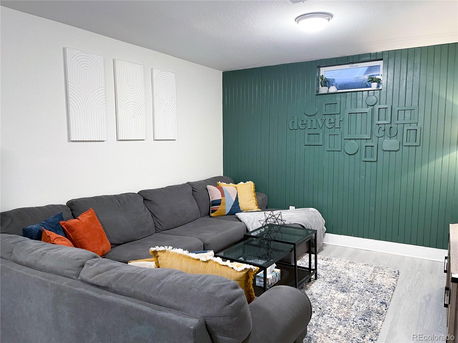 7051 Ruth Way Denver, CO 80221 - Photo 21 of 36 a living room with furniture and a rug