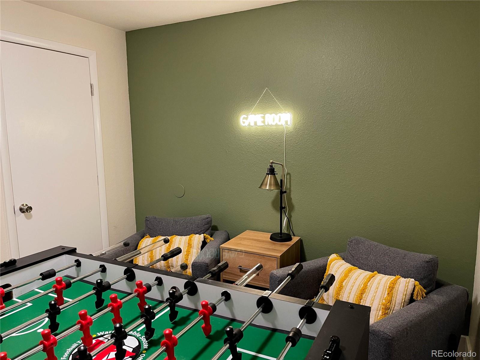 7051 Ruth Way Denver, CO 80221 - Photo 29 of 36 a bedroom with a bed and glass door