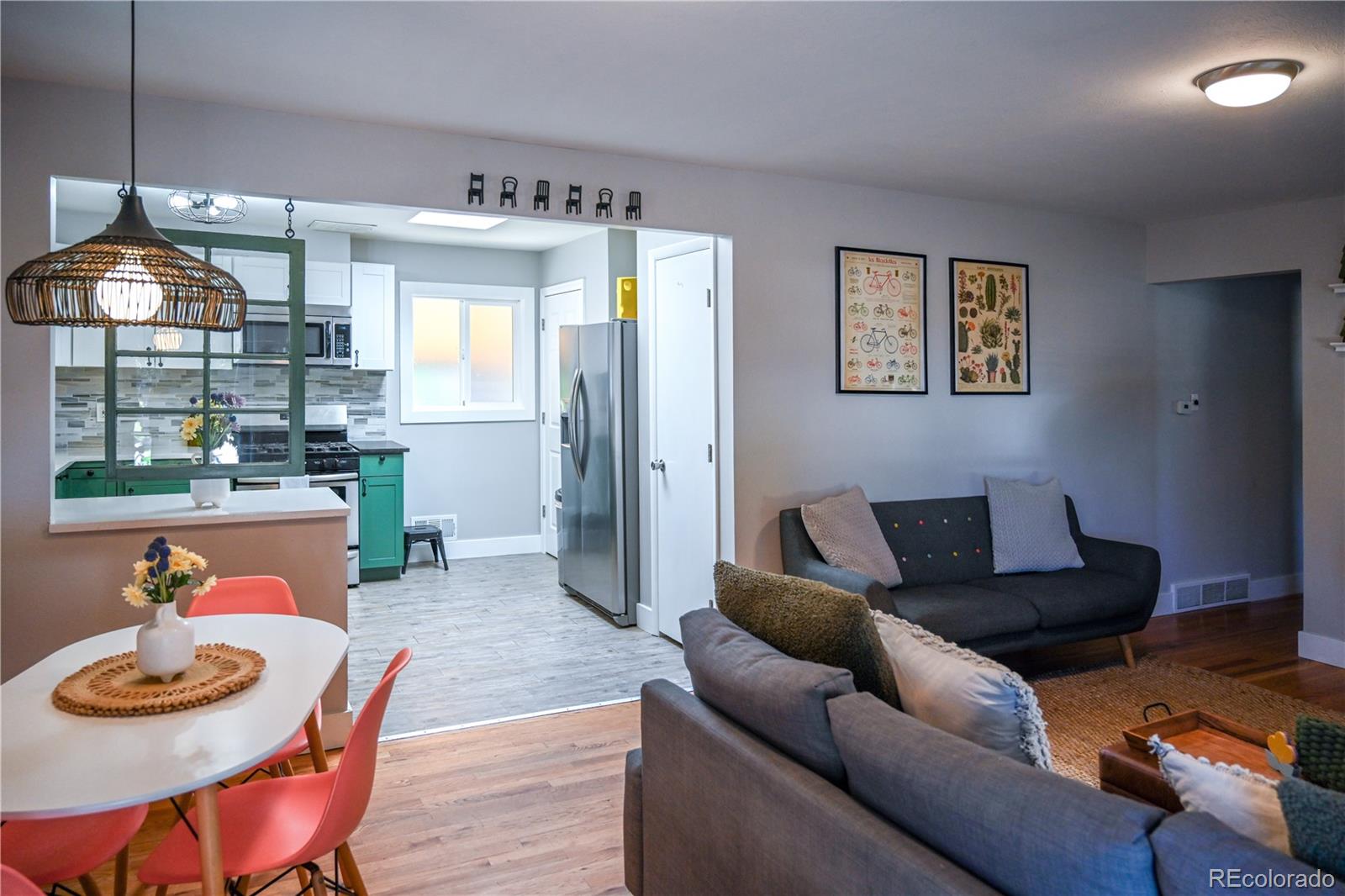 7051 Ruth Way Denver, CO 80221 - Photo 3 of 36 a living room with furniture and a window
