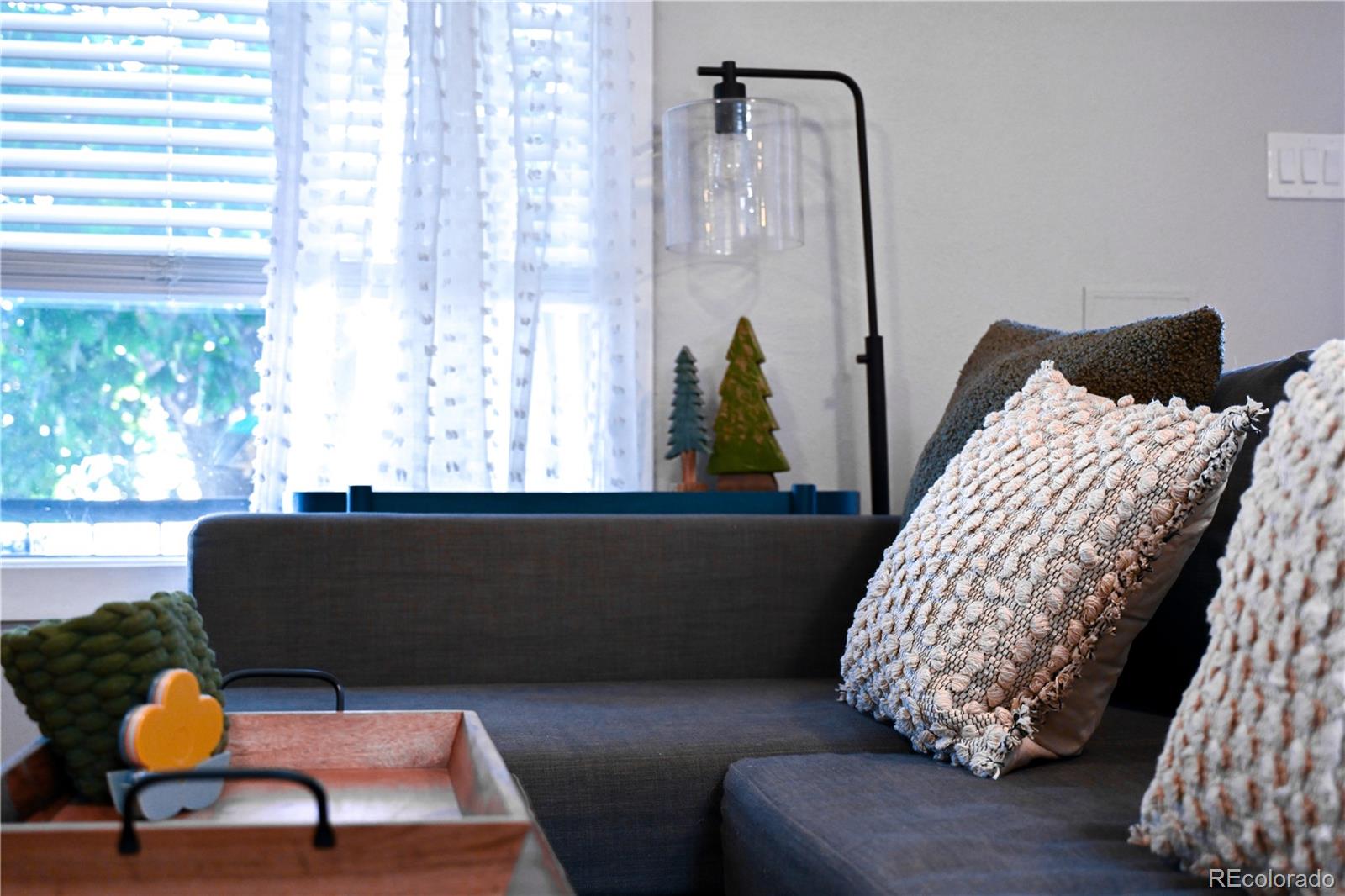 7051 Ruth Way Denver, CO 80221 - Photo 35 of 36 a living room with furniture and a window