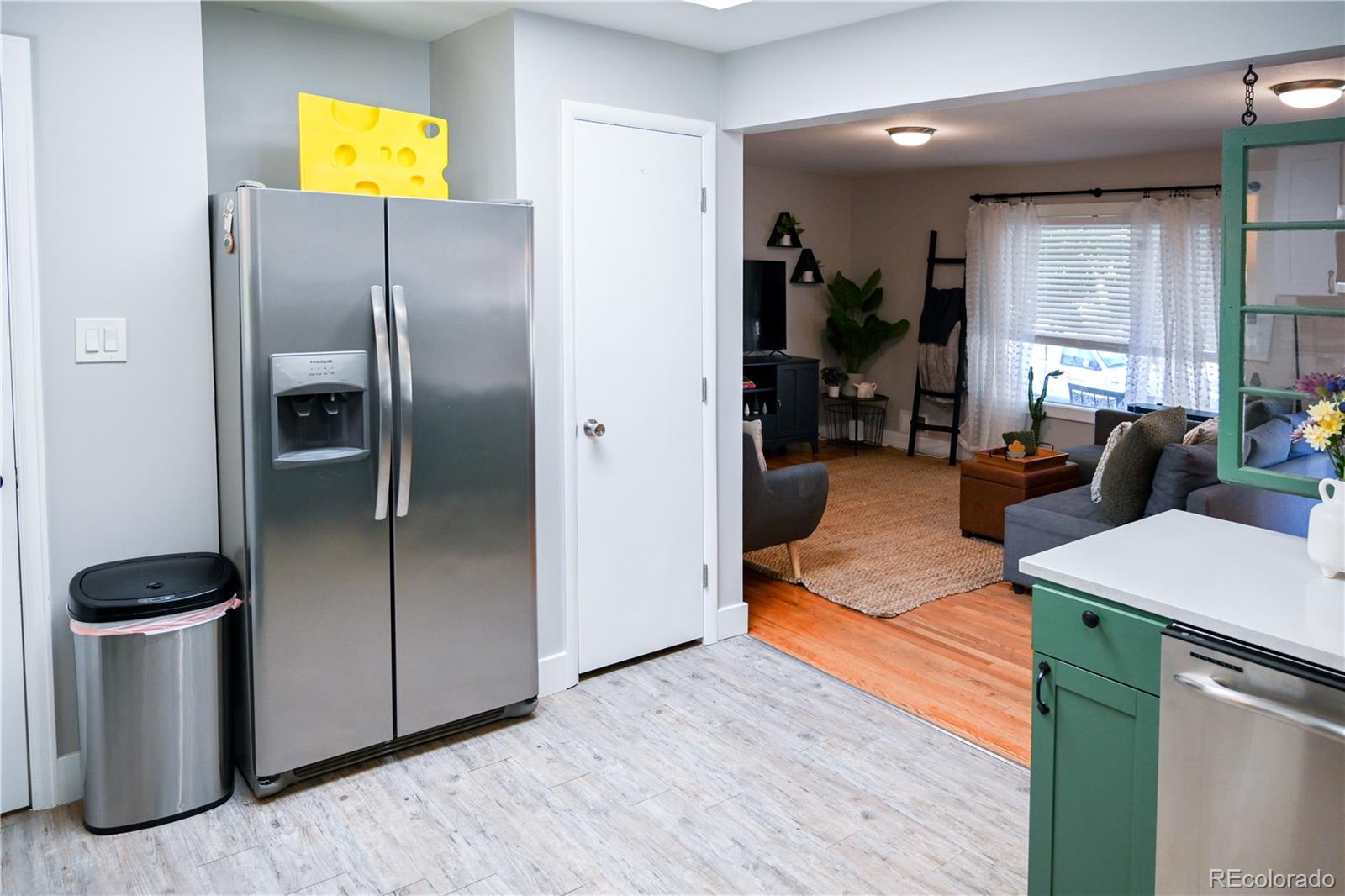 7051 Ruth Way Denver, CO 80221 - Photo 7 of 36 a kitchen with stainless steel appliances granite countertop a refrigerator and a stove
