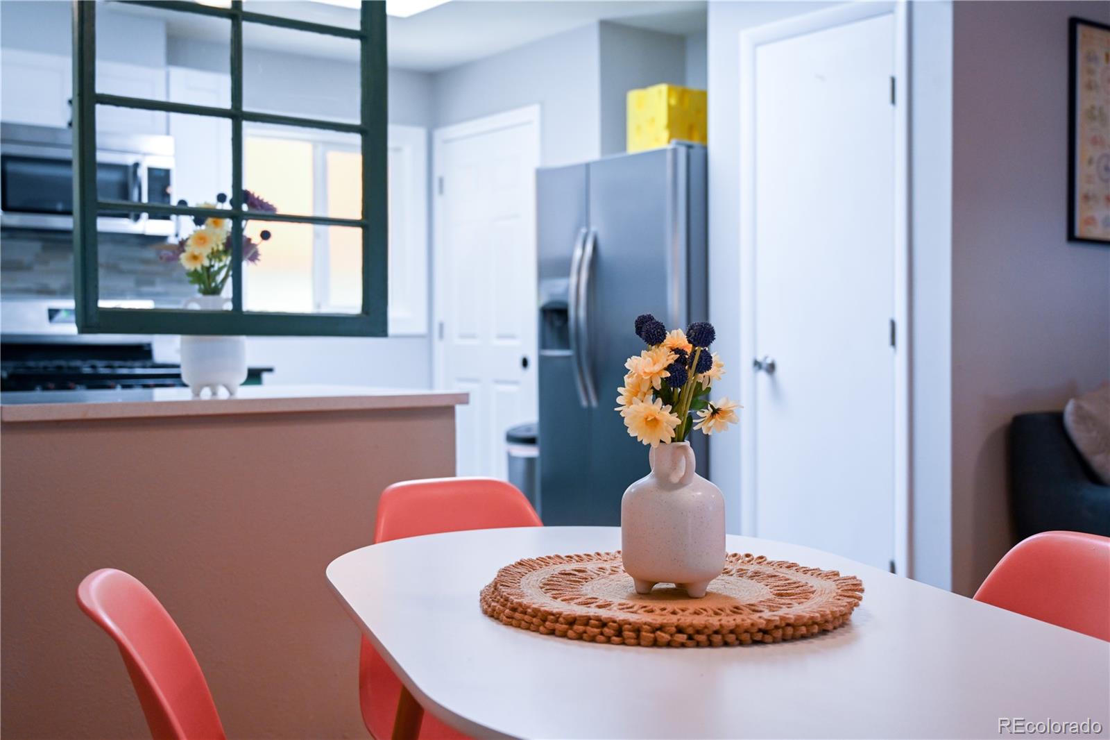 7051 Ruth Way Denver, CO 80221 - Photo 9 of 36 a vase of flowers sitting on a table