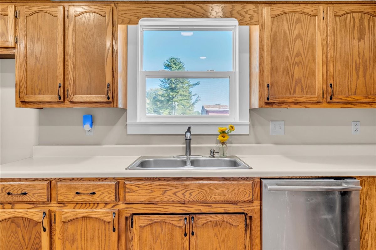 145 Hawkins Road Smithville, TN 37166 - Photo 13 of 45 a kitchen with stainless steel appliances granite countertop a sink and a window