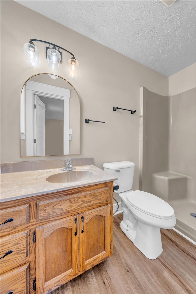 145 Hawkins Road Smithville, TN 37166 - Photo 16 of 45 a bathroom with a granite countertop toilet sink and mirror