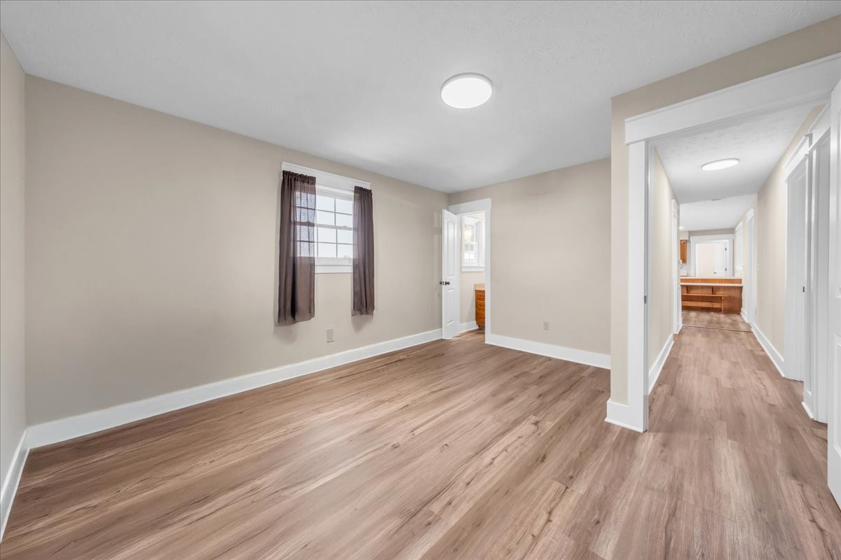 145 Hawkins Road Smithville, TN 37166 - Photo 18 of 45 wooden floor in an empty room with a window